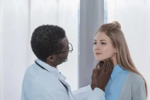 depositphotos 174433576 stock photo doctor palpating lymph nodes